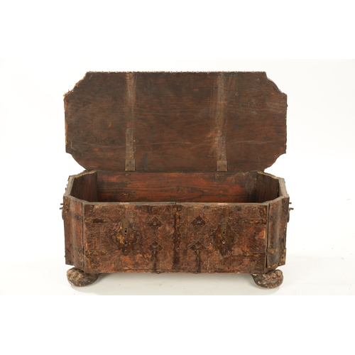 96 - A 17TH CENTURY ITALIAN LEATHER BOUND CASKET with unusual hinged front bearing double locks, side han... 