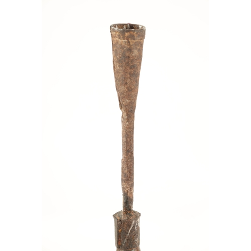 97 - AN 18TH CENTURY PINE AND WROUGHT IRON RUSTIC CANDLESTICK ON STAND with X shaped base (84cm high)