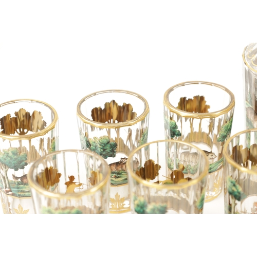 460 - A LATE 19TH CENTURY BOHEMIAN GLASS AND ENAMEL DRINKS SET the jug of faceted form, gilt rim and decor... 