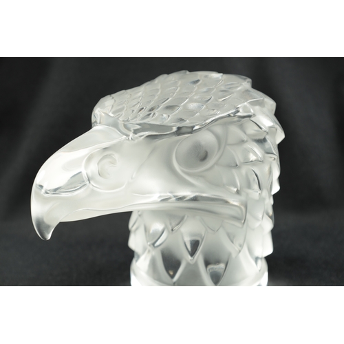 461 - A RENE LALIQUE 'TETE D'AIGLE' CLEAR AND FROSTED GLASS CAR MASCOT on a circular base moulded signatur... 