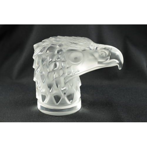 461 - A RENE LALIQUE 'TETE D'AIGLE' CLEAR AND FROSTED GLASS CAR MASCOT on a circular base moulded signatur... 