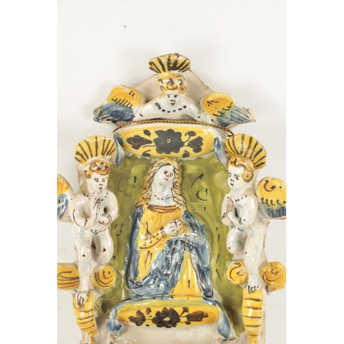 470 - AN EARLY DELFTWARE HANGING HOLY WATER FONT decorated with cherubs surrounding Mary with polychrome c... 