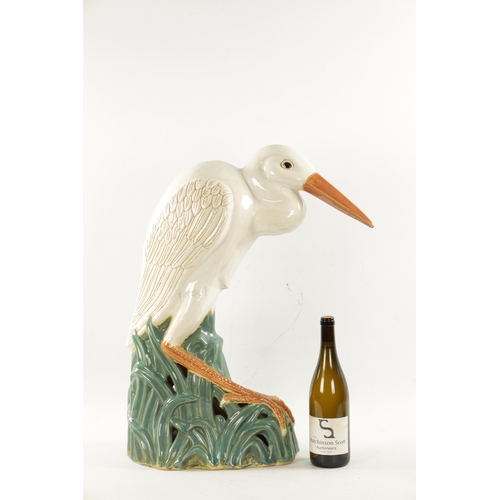 475 - A LATE 19TH CENTURY MAJOLICA SCULPTURE OF A STORK (64cm high)