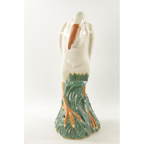 475 - A LATE 19TH CENTURY MAJOLICA SCULPTURE OF A STORK (64cm high)