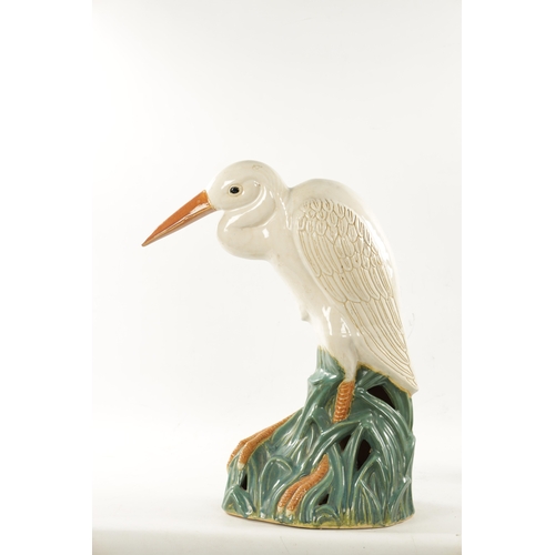 475 - A LATE 19TH CENTURY MAJOLICA SCULPTURE OF A STORK (64cm high)