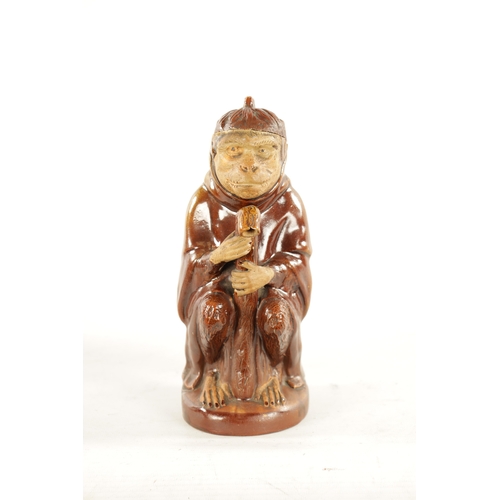 476 - A 19TH CENTURY POTTERY MONKEY PITCHER JUG in the style of Bodlet Vaudancourt, modelled as a clothed ... 