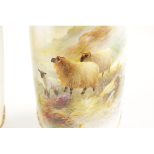 477 - HARRY DAVIS A FINE PAIR OF ROYAL WORCESTER CABINET VASES the cylindrical bodies finely painted with ... 