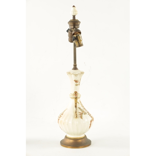 482 - AN EARLY 20TH CENTURY BLUSH ROYAL WORCESTER TABLE LAMP decorated with gilt highlighted leafwork (62c... 