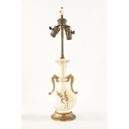 482 - AN EARLY 20TH CENTURY BLUSH ROYAL WORCESTER TABLE LAMP decorated with gilt highlighted leafwork (62c... 