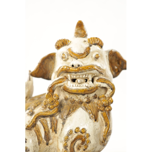 495 - A PAIR OF 19TH CENTURY CHINESE CERAMIC FOO DOGS with gilt highlights (22cm high 23cm wide )