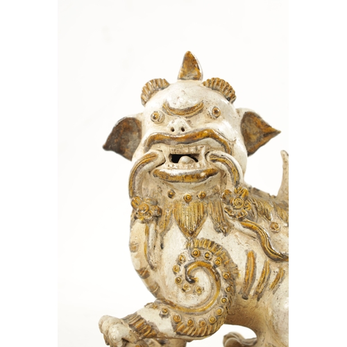 495 - A PAIR OF 19TH CENTURY CHINESE CERAMIC FOO DOGS with gilt highlights (22cm high 23cm wide )