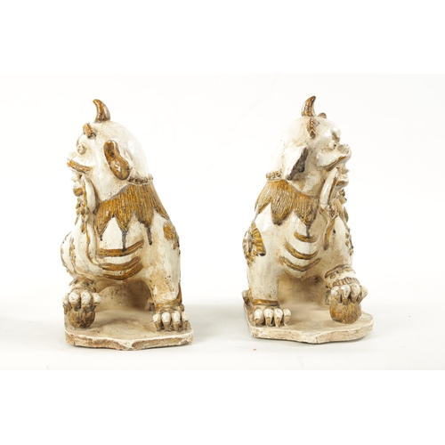 495 - A PAIR OF 19TH CENTURY CHINESE CERAMIC FOO DOGS with gilt highlights (22cm high 23cm wide )