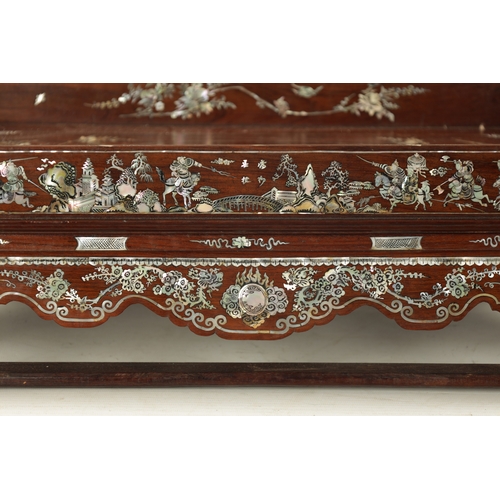 500 - A 19TH CENTURY CHINESE HARDWOOD AND MOTHER OF PEARL INLAID TRAY ON STAND decorated with landscapes. ... 