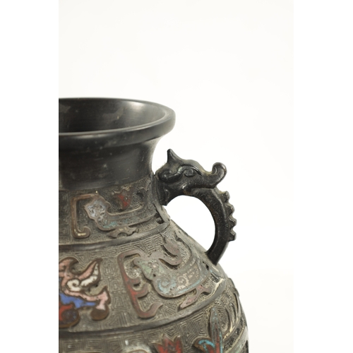 502 - A CHINESE BRONZE AND CLOISONNE ENAMEL VASE decorated with dragon, birds and flowers. (30.5cm high)