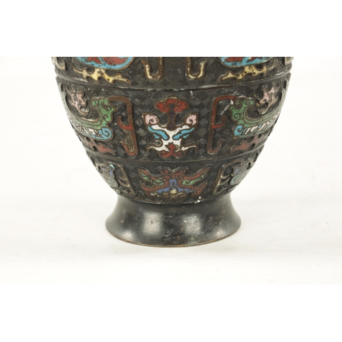 502 - A CHINESE BRONZE AND CLOISONNE ENAMEL VASE decorated with dragon, birds and flowers. (30.5cm high)