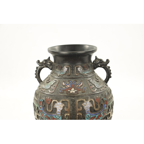 502 - A CHINESE BRONZE AND CLOISONNE ENAMEL VASE decorated with dragon, birds and flowers. (30.5cm high)