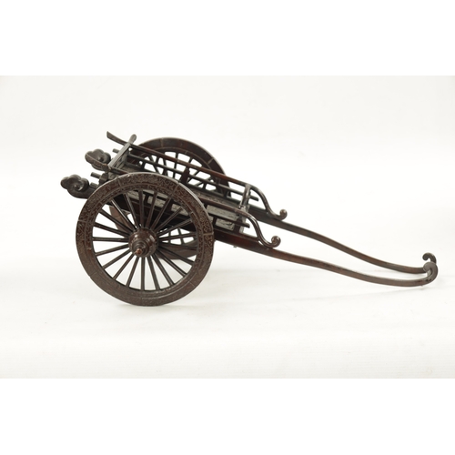 509 - A JAPANESE MEIJI PERIOD PATINATED BRONZE MODEL OF A CARRIAGE with floral decoration and spoke wheels... 