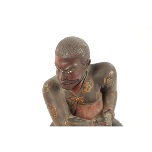 515 - A LARGE MEIJI PERIOD JAPANESE CARVED LACQUERED SCULPTURE highlighted with gilt decoration modelled a... 