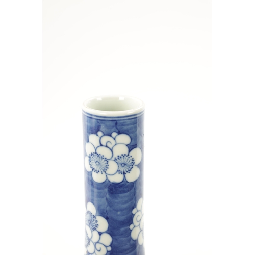 517 - A 19TH CENTURY CHINESE BLUE AND WHITE BOTTLENECK VASE with prunus pattern ground and floral panels. ... 