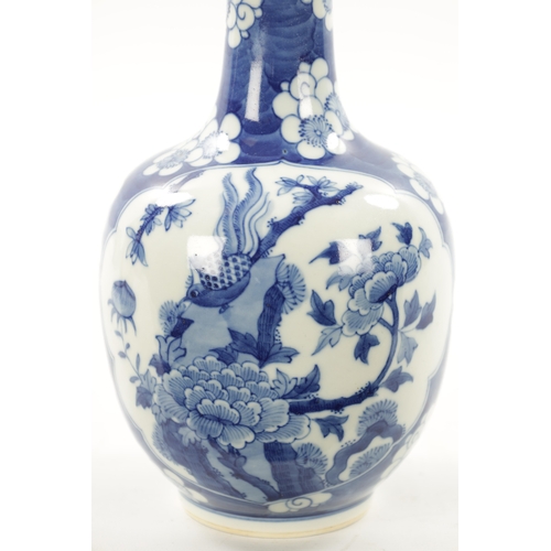 517 - A 19TH CENTURY CHINESE BLUE AND WHITE BOTTLENECK VASE with prunus pattern ground and floral panels. ... 