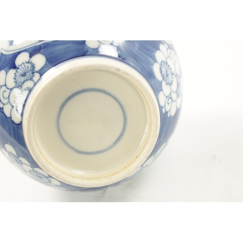 517 - A 19TH CENTURY CHINESE BLUE AND WHITE BOTTLENECK VASE with prunus pattern ground and floral panels. ... 