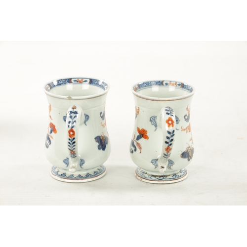 524 - A PAIR OF 18TH CENTURY CHINESE IMARI TANKARDS of baluster form decorated with flowering branchwork, ... 