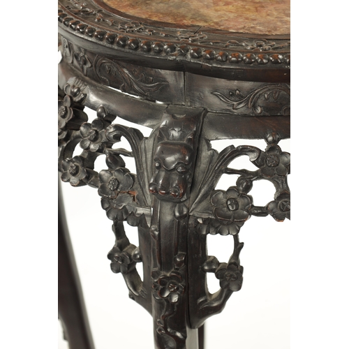 529 - A 19TH CENTURY CHINESE CARVED HARDWOOD JARDINIERE STAND the shaped top with carved border enclosing ... 