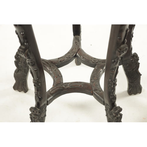 529 - A 19TH CENTURY CHINESE CARVED HARDWOOD JARDINIERE STAND the shaped top with carved border enclosing ... 