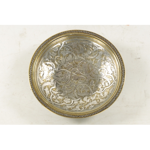 535 - AN 18TH/19TH CENTURY MIDDLE EASTERN CAST BRASS AND SILVER INLAY SHALLOW BOWL with leaf spray and fol... 