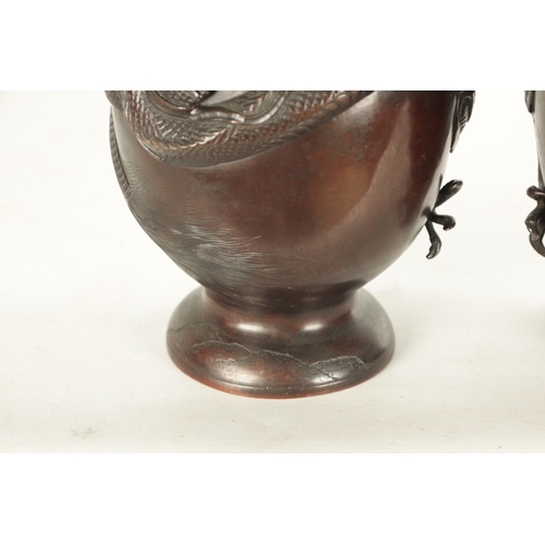 537 - A PAIR OF TWO LATE 19TH CENTURY CHINESE BRONZE VASES with entwined dragon decoration (42.5cm high)