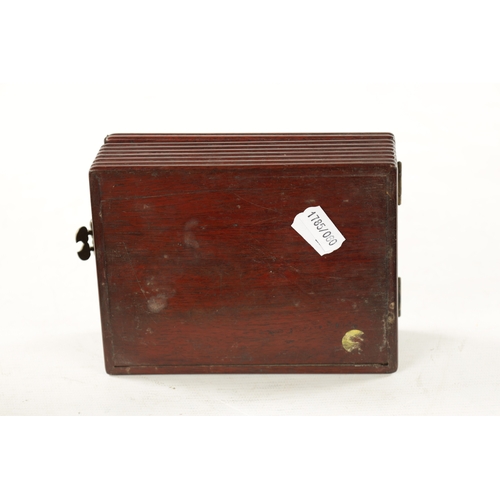 547 - A CHINESE HARDWOOD DRESSING TABLE BOX with hinged mirrored lid, reeded sides and shaped brass catch ... 