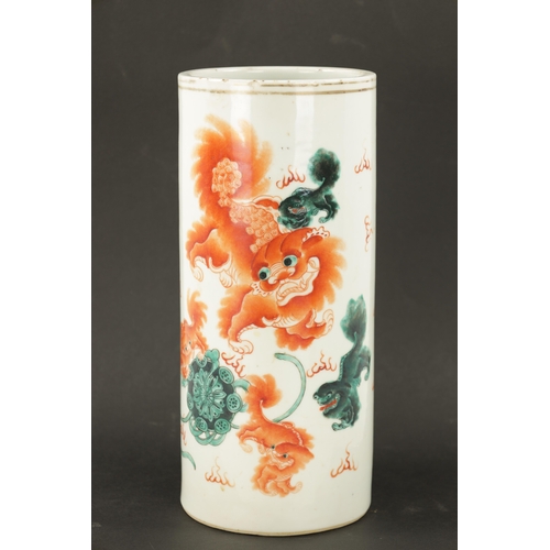 548 - AN EARLY 20TH CENTURY IRON RED CHINESE PORCELAIN CYLINDRICAL VASE painted with foo dogs and calligra... 