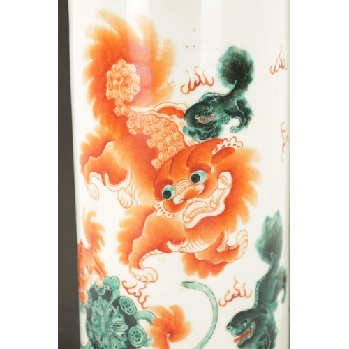 548 - AN EARLY 20TH CENTURY IRON RED CHINESE PORCELAIN CYLINDRICAL VASE painted with foo dogs and calligra... 