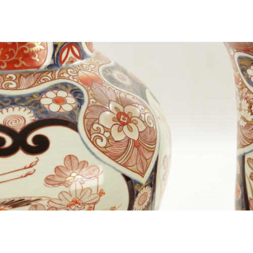 549 - A SUITE OF FIVE 18TH CENTURY JAPANESE EDO PERIOD IMARI VASES decorated with storks in landscape sett... 