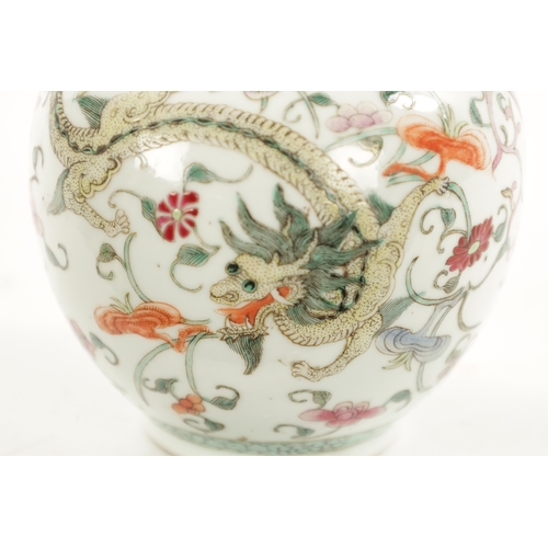 555 - A 19TH CENTURY CHINESE FAMILLE ROSE BULBOUS VASE OF SMALL SIZE decorated with a Dragon amongst flora... 