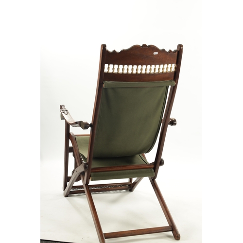 557 - A LATE 19TH CENTURY ANGLO INDIAN IVORY INLAID HARDWOOD FOLDING CHAIR with ivory balustrade and carve... 