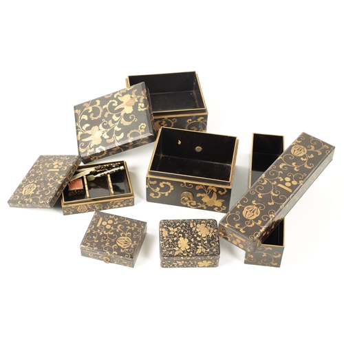 558 - A COLLECTION OF FIVE JAPANESE MEIJI PERIOD LACQUER WORK BOXES decorated with gilt scrolling floral d... 