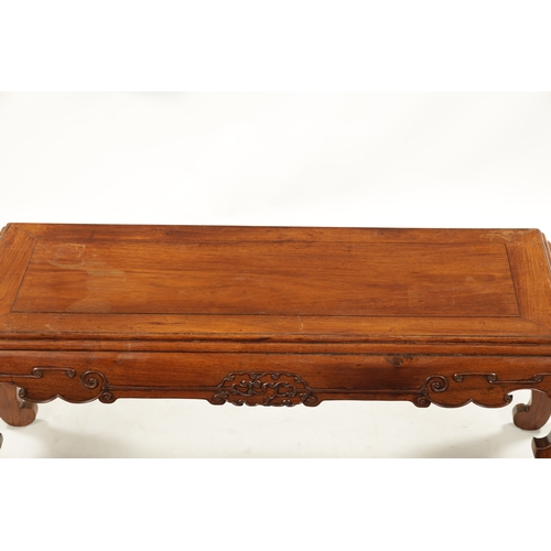 562 - A 19TH CENTURY CHINESE HUANGHUALI WOOD ALTER TABLE with panelled top above a scroll carved base join... 