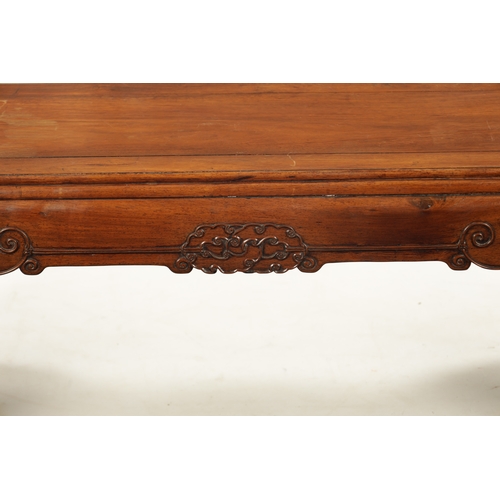 562 - A 19TH CENTURY CHINESE HUANGHUALI WOOD ALTER TABLE with panelled top above a scroll carved base join... 