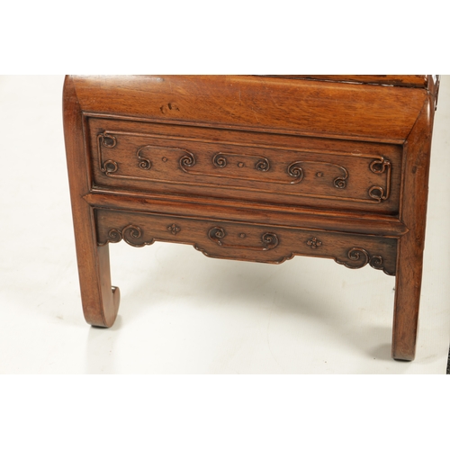 562 - A 19TH CENTURY CHINESE HUANGHUALI WOOD ALTER TABLE with panelled top above a scroll carved base join... 