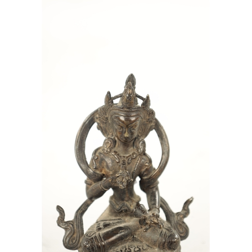 568 - A 19TH CENTURY INDIAN TIBETAN BRONZE FIGURE OF A SEATED BUDDHA (12cm high)