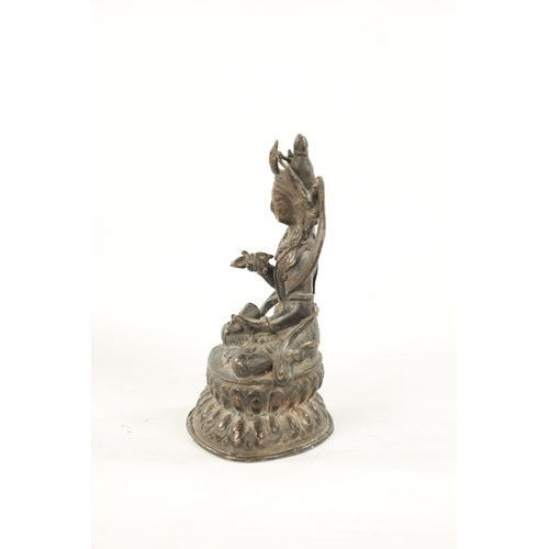 568 - A 19TH CENTURY INDIAN TIBETAN BRONZE FIGURE OF A SEATED BUDDHA (12cm high)