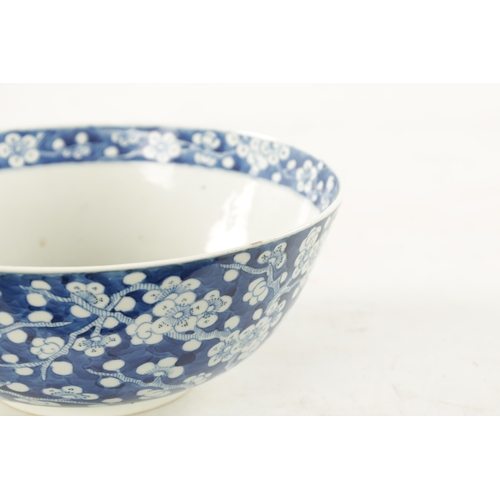 570 - A LARGE 19TH CENTURY CHINESE BLUE AND WHITE PORCELAIN PRUNUS BOWL all-over decoration of entwined br... 