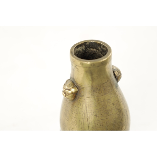 574 - AN 18TH / 19TH CENTURY MINIATURE CHINESE BRONZE VASE of slender bulbous form with foo dog handles - ... 