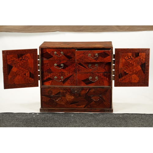 575 - A JAPANESE MEIJI PERIOD INLAID COLLECTOR'S CABINET OF LARGE SIZE with hinged doors revealing small d... 