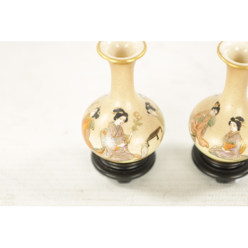 580 - A PAIR OF FINE JAPANESE MEIJI PERIOD SATSUMA MINIATURE BOTTLE VASES having finely decorated figures ... 