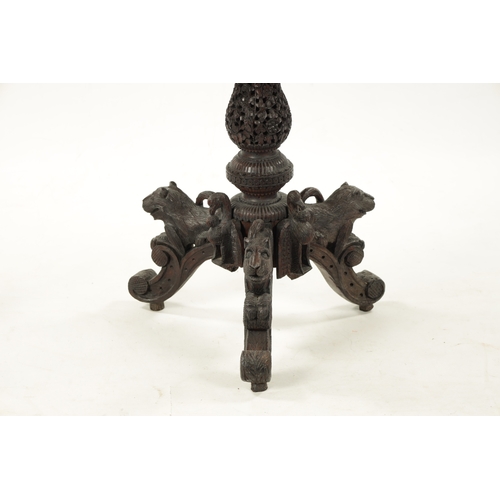 582 - A 19TH CENTURY CARVED HARDWOOD ANGLO INDIAN CENTRE TABLE with pierced leaf carved decoration above a... 