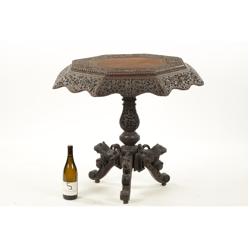 582 - A 19TH CENTURY CARVED HARDWOOD ANGLO INDIAN CENTRE TABLE with pierced leaf carved decoration above a... 