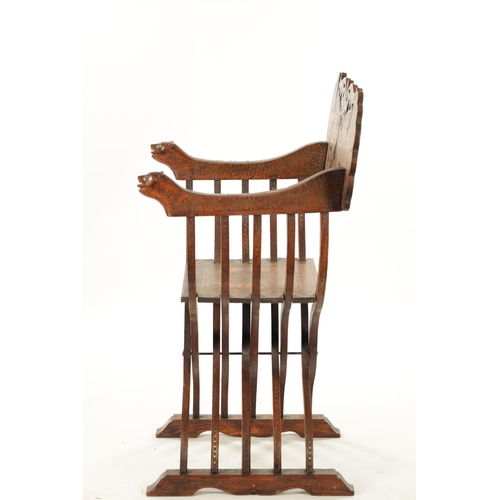 584 - A 19TH CENTURY INDIAN HARDWOOD AND BRASS INLAID FOLDING SAVONAROLA ARMCHAIR with peacock-shaped back... 