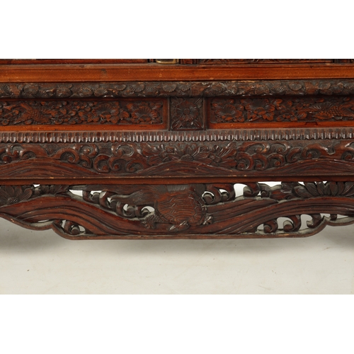 585 - A FINE JAPENESE MEIJI PERIOD CARVED HARDWOOD SHIBIYAMA COLLECTOR’S CABINET comprising of sliding shi... 